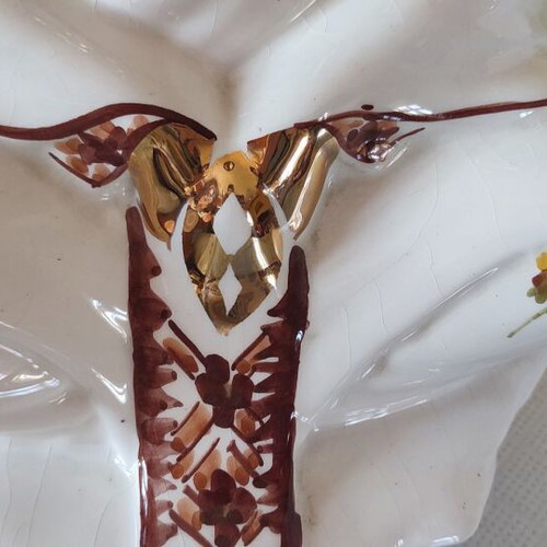 Vintage porcelain Buddha statue with gold details