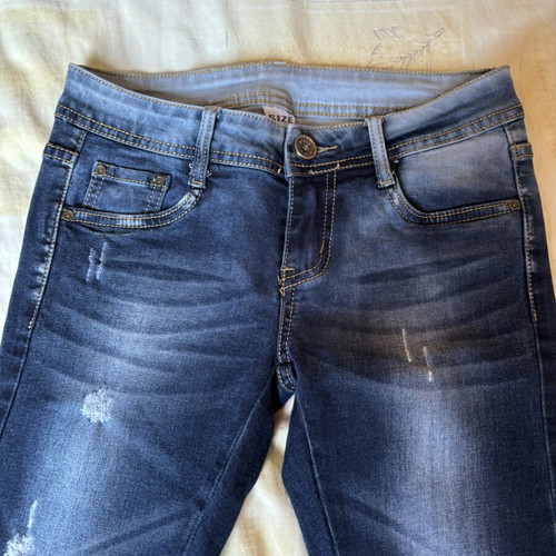 Dark blue skinny jeans with black lace and distressed details, size S, like new