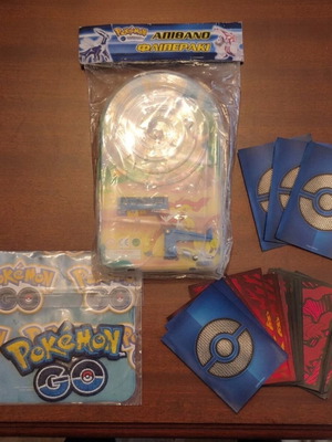 Pokemon set: vintage flipper, sleeves, embroidered badge