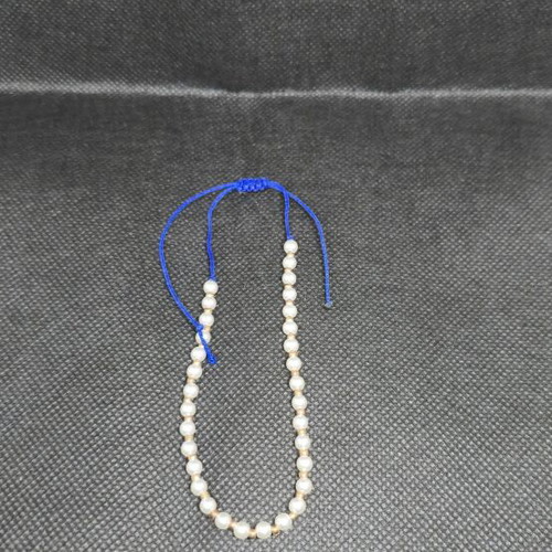 Handmade bracelet with pearls and blue cord like new