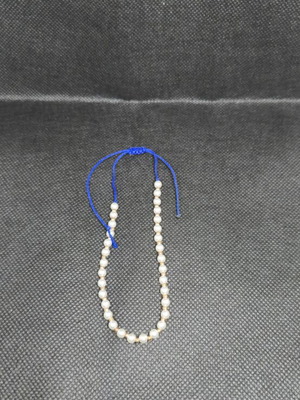 Handmade bracelet with pearls and blue cord like new