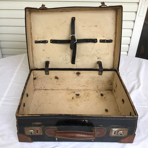 Small antique suitcase used with wear