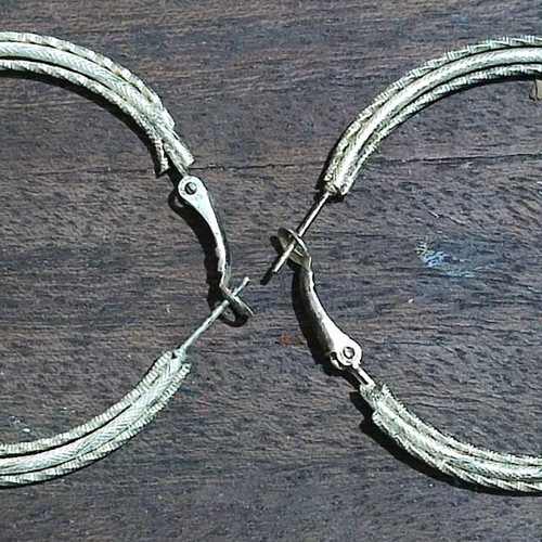 Metal earrings used, silver iron color