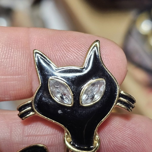 Cat brooch, black and gold