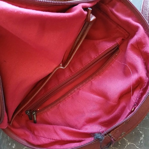 Women's burgundy backpack bag used
