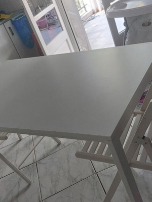 IKEA white dining set with 4 folding chairs