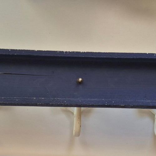 Wall hanger with 3 whale tails on blue wood like new