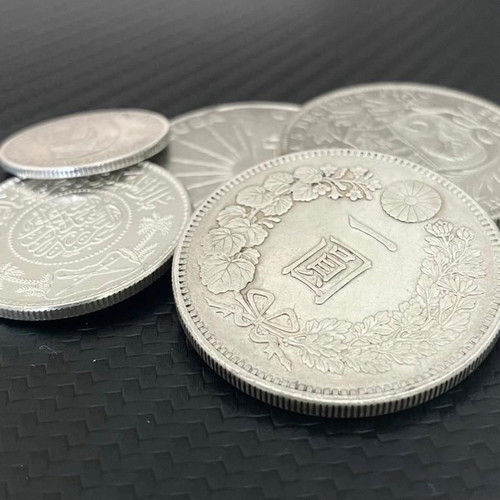 Silver coins from Cuba, Peru, Japan, Saudi Arabia