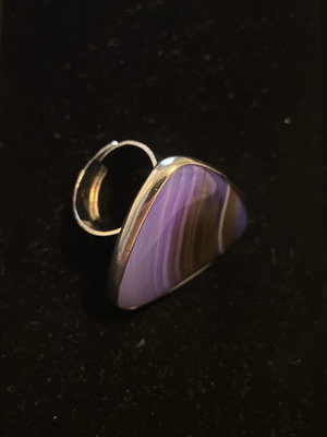 Handmade ring with steel setting and purple stone appearance like new