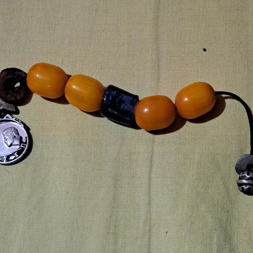 Begleri with 4 large amber-bakelite beads and 1 blue blown glass bead like new