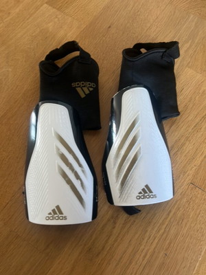 Adidas shin guards used with integrated elastic support