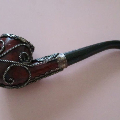 Wooden pipe with intricate silver decoration used