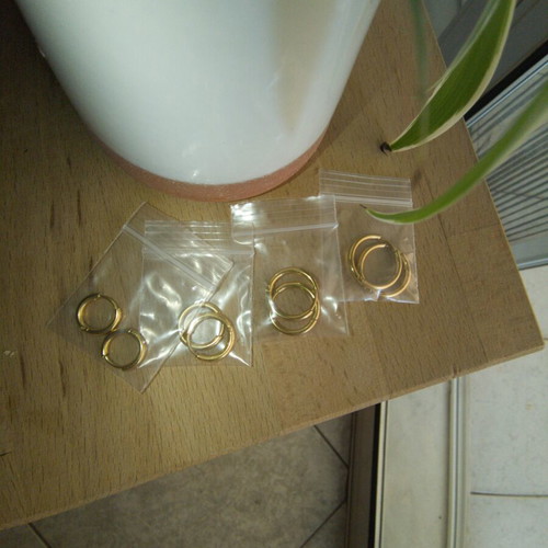 Gold stainless steel hoop earrings, 4 pairs, new in packaging