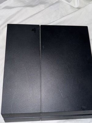 PlayStation 4 console with FIFA 19 and cables