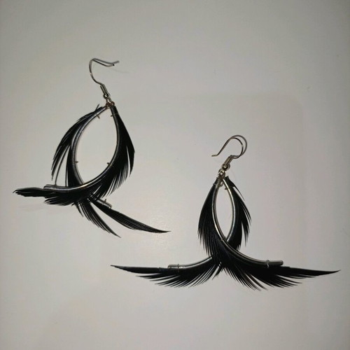 Fallen Angel earrings like new with black hanging feathers