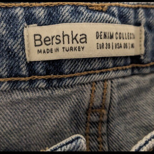 Bershka denim jean shorts like new with rips and paint splatters, size 38