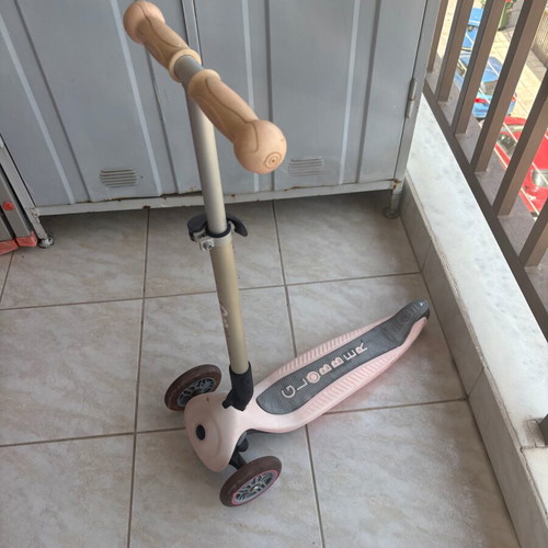 Pink children's scooter used with light-up wheels