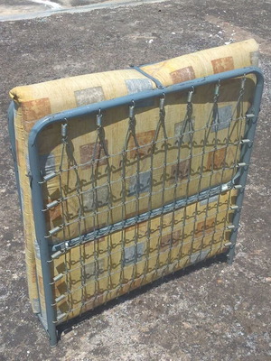 Metal folding bed with mattress used, sturdy and comfortable