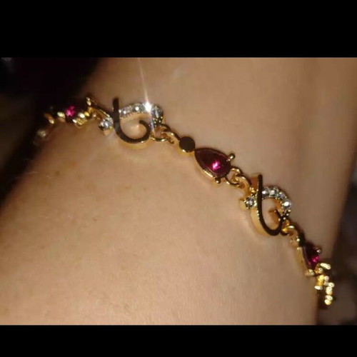 Bracelet with rubies and crystals new, gold and pink
