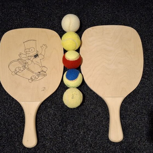 Wooden rackets and 5 balls like new, one custom painted