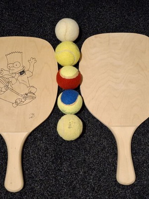 Wooden rackets and 5 balls like new, one custom painted