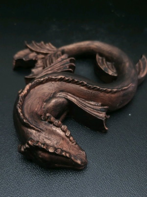 Gypsum dragon figurine new in bronze color