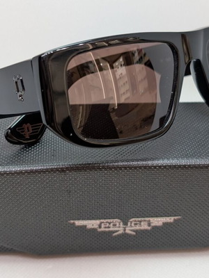 Police Ανδρικά Γυαλιά Ηλίου Καινούργια με Μαύρο Κοκκάλινο Σκελετό και Καφέ Φακό SPLL13 700Y