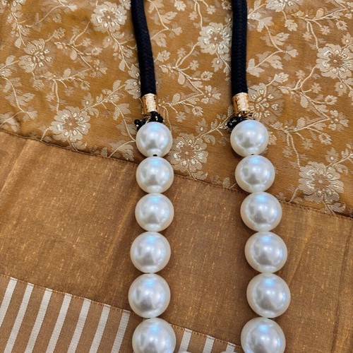 Pendant like new with large black and white beads