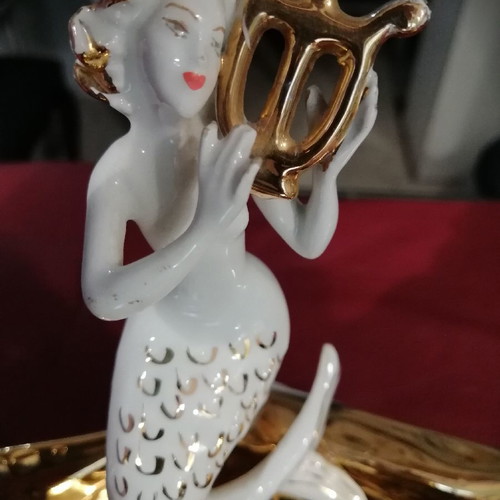 Mermaid and clam used, gold and porcelain decoration