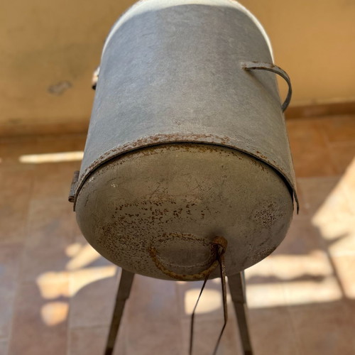 Handmade metal BBQ grill with lid used, industrial style