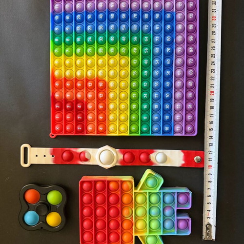 Set of 7 Pop It toys like new, includes multiplication learning