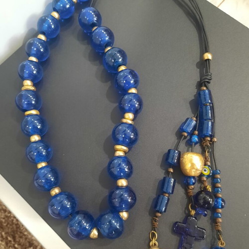 Decorative komboloi with large blue glass beads used, leather, bronze accents