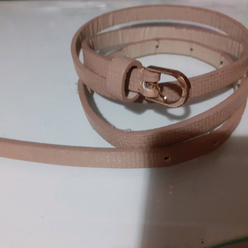 Beige belt thin like new with embossed leatherette and gold buckle