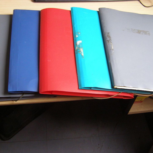 Plastic folders with elastic and tabs used, various colors