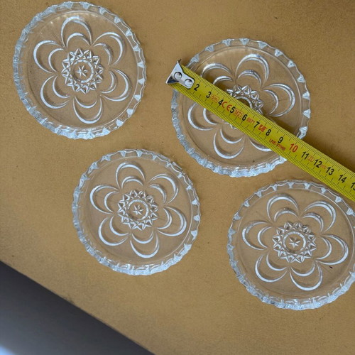 Set of 4 vintage glass coasters like new with embossed design