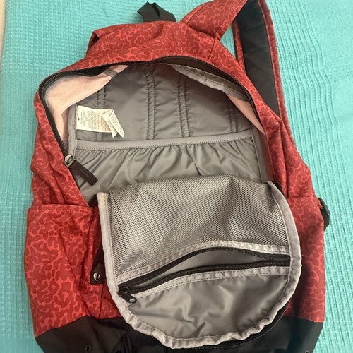 Nike backpack with one broken zipper, like new, black and red