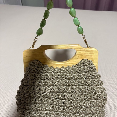 Handmade knitted beige bag with wooden magnetic clasp and beaded handle