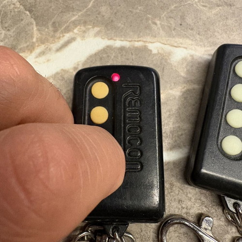 Garage door remotes used, set of 10, one broken with tape