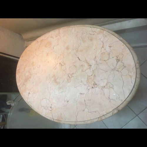 Vintage table with bent wood and oval salmon-pink marble used