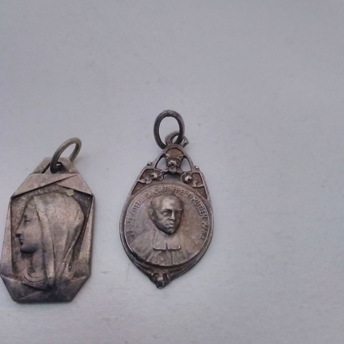 Silver pendant necklace used with zodiac and catholic figures