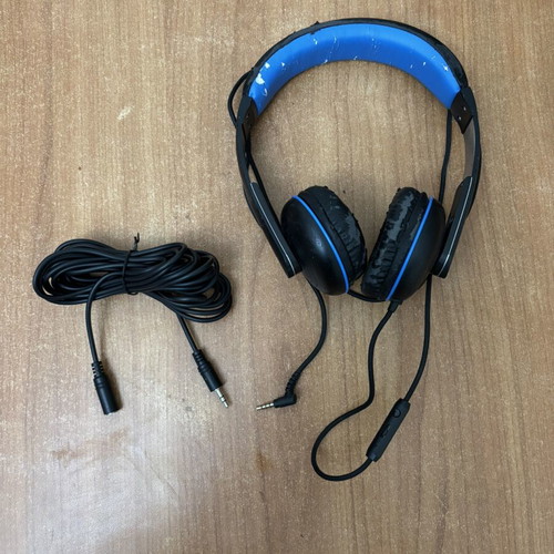 Wired headphones with 5m extension cable used, visible wear on plastic