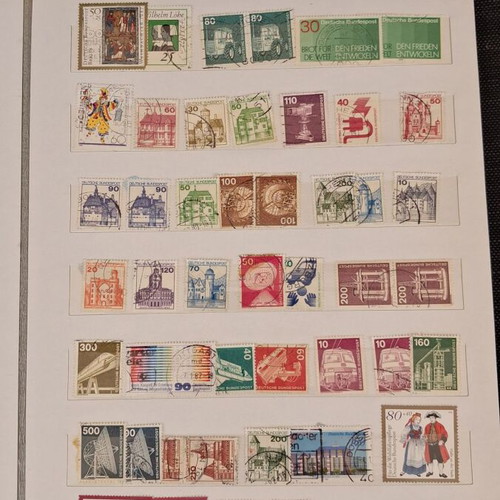 Stamp album used with 10 pages of foreign stamps 1960-1990