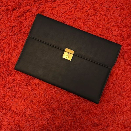 Clutch used, black with gold clasp, leatherette material