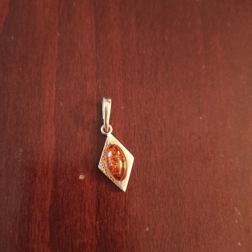 Silver pendant with amber new