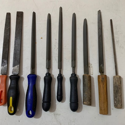 Metal files used, triangular, flat and round