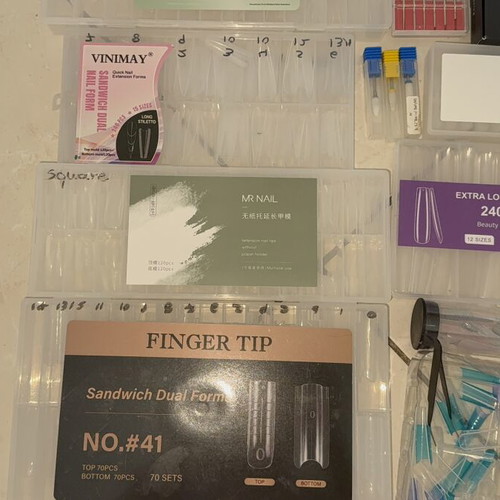 Nail products set like new with dual forms, tips, and accessories