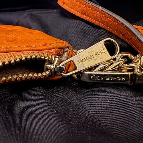 Michael Kors mini leather wallet used orange