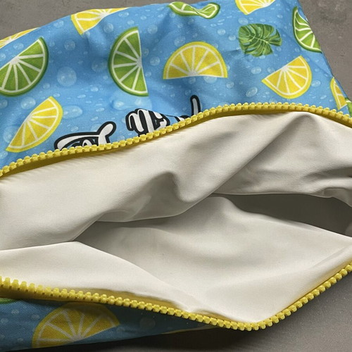 Hei Poa summer makeup bag with lemon and lime pattern
