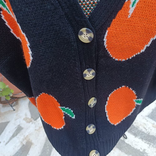 Knitted winter cardigan with buttons one size new, black with orange fruit design
