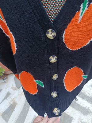 Knitted winter cardigan with buttons one size new, black with orange fruit design